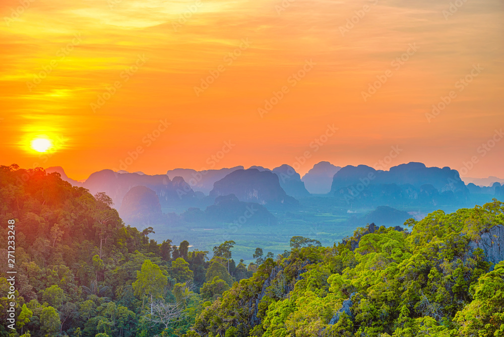 Majestic landscape with dramatic sunset and silhouette of steep mountain ridge on horizon. HDR image Majestic landscape with dramatic sunset and silhouette of steep mountain ridge on horizon. HDR image