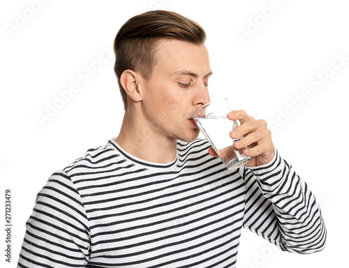 Handsome young man drinking...
