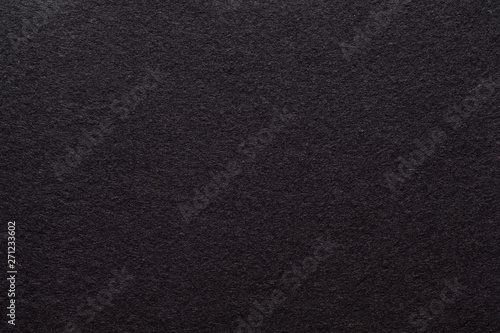Dark brown felt texture abstract art background. Colored fabric fibers surface. Empty space.