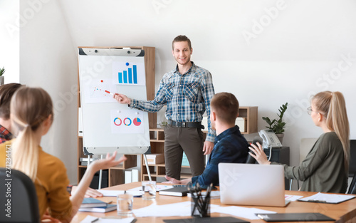 Young businessman giving pr...