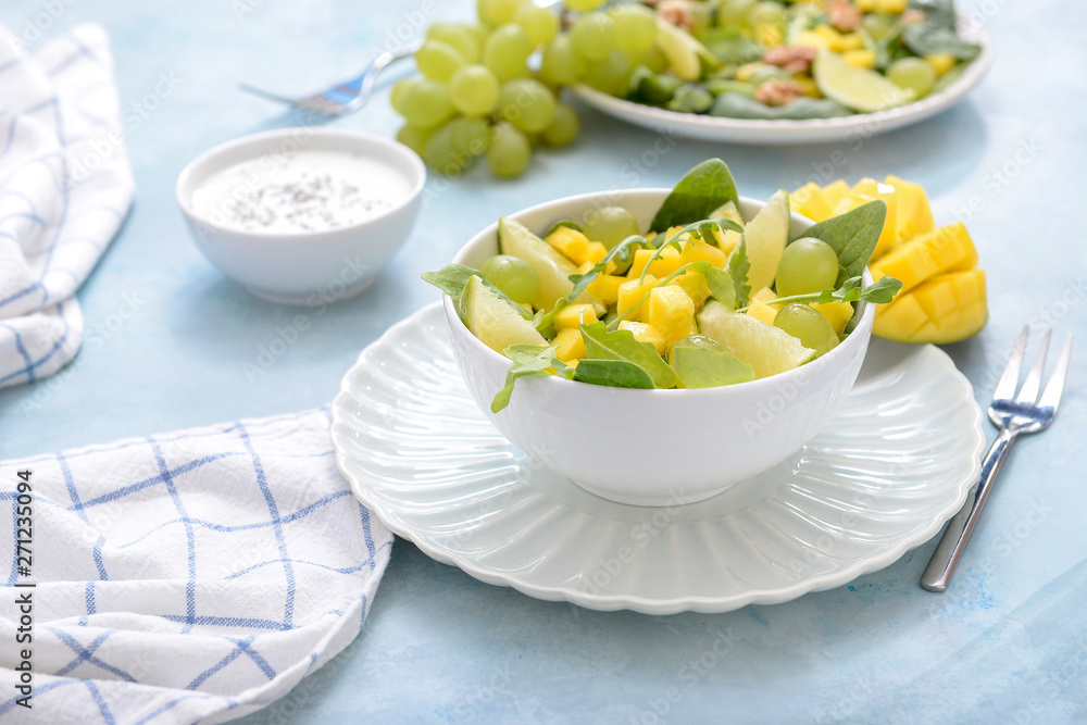 Bowl with tasty mango salad on table Bowl with tasty mango salad on table
