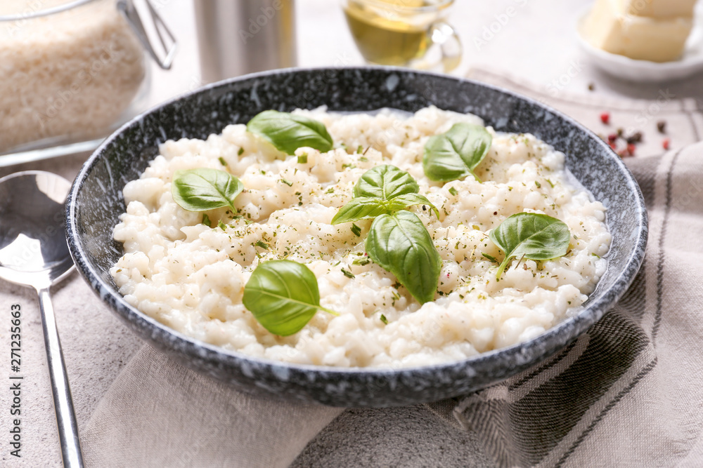 Plate with tasty risotto on table Plate with tasty risotto on table