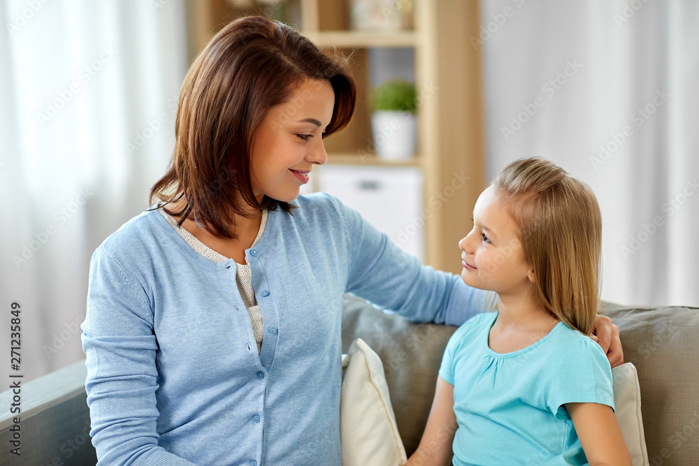 family, generation and people concept - happy smiling mother and daughter looking at each other at home family, generation and people concept - happy smiling mother and daughter looking at each other at home