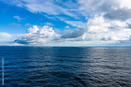 LANDSCAPE OF SEA AND HORIZON OF HEAVEN AND WHITE CLOUDS IN THE SEA OF THE NORTH