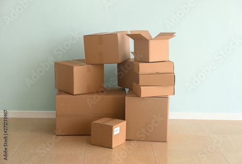 Cardboard boxes near light wall