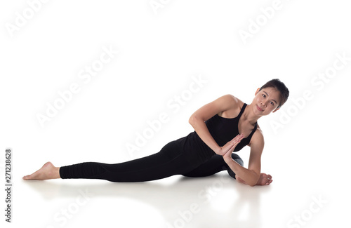 Portrait of sporty fit beautiful young woman in black sportswear working out, studio full length, isolated on white background.