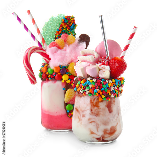 Different delicious freak shakes on white background photo