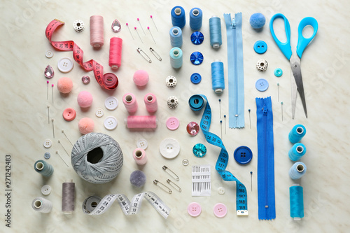 Set of sewing threads and accessories on light background