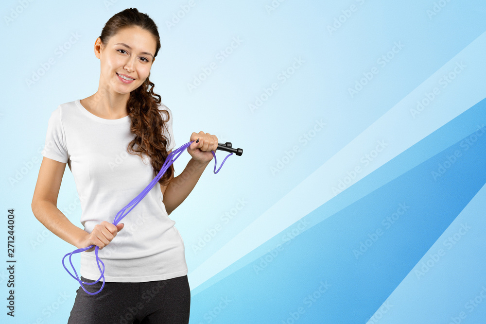 Cropped shot of young sporty woman holding skipping rope Cropped shot of young sporty woman holding skipping rope