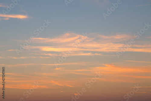 some light clouds in the light of a sunset  for backgrounds