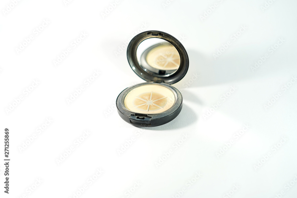 Face powders after used (Hit pan) in round shape with a mirror in front view.Face cosmetic makeup compact powder, foundation make-up. Face powders after used (Hit pan) in round shape with a mirror in front view.Face cosmetic makeup compact powder, foundation make-up.