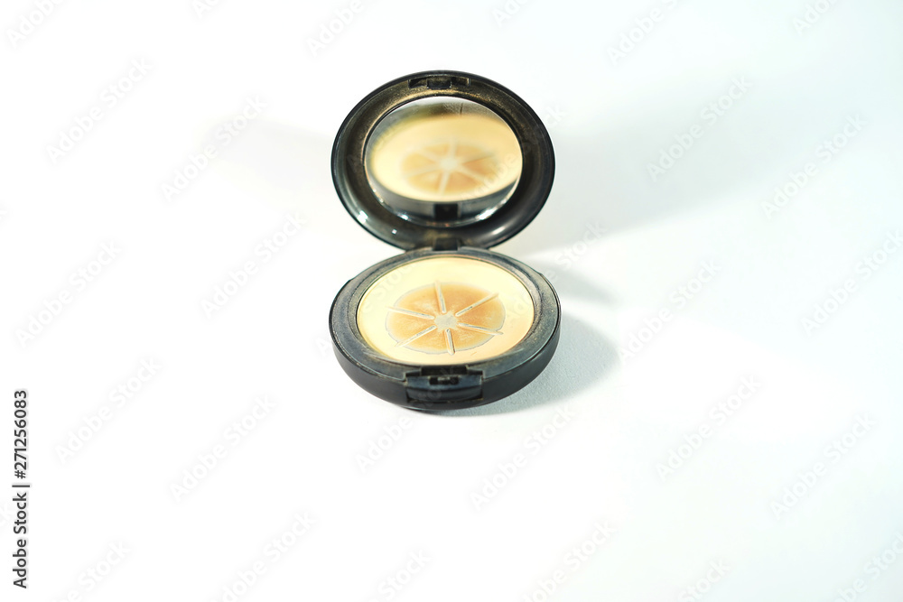 Face powders after used (Hit pan) in round shape with a mirror in front view.Face cosmetic makeup compact powder, foundation make-up. Face powders after used (Hit pan) in round shape with a mirror in front view.Face cosmetic makeup compact powder, foundation make-up.