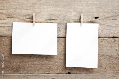 Stylish invitation layout - two empty cards on a wooden background