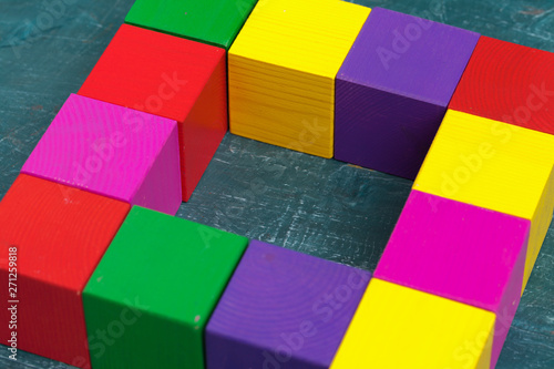 Colorful wooden blocks background, top view