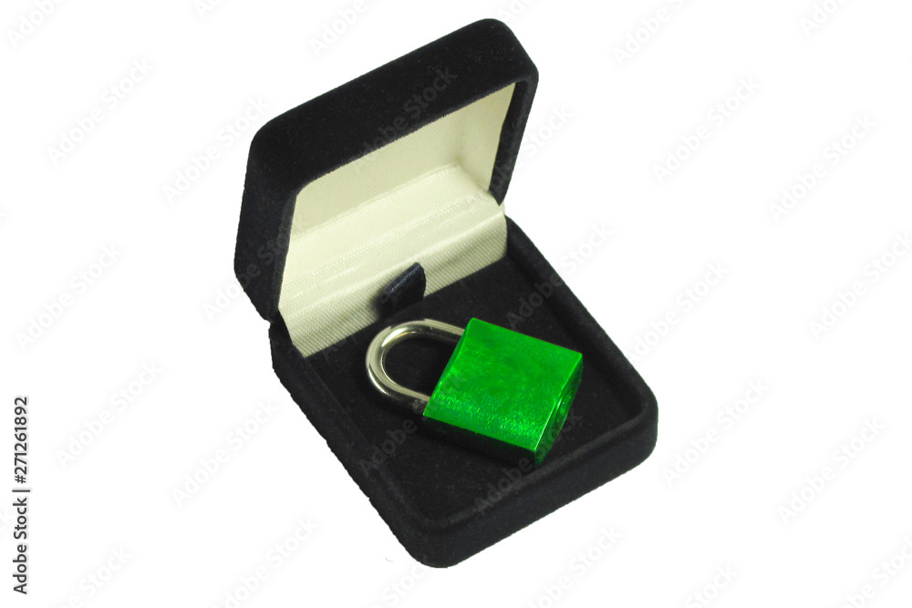 Lock in gift box. Green padlock with closed shackle in jewelry chest. Concept of security safe or protection software or hardware. Symbol of engagement or wedding or marriage. Isolated background Lock in gift box. Green padlock with closed shackle in jewelry chest. Concept of security safe or protection software or hardware. Symbol of engagement or wedding or marriage. Isolated background