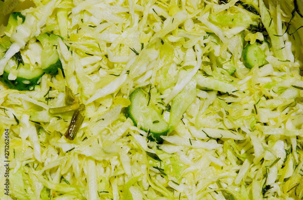 Juicy salad consists of sliced cabbage, cucumber and spices. Juicy salad consists of sliced cabbage, cucumber and spices.