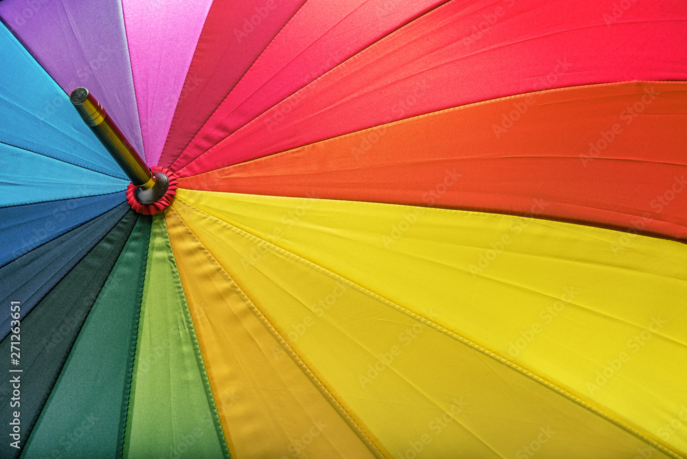 Multicolored umbrella as a background image. Multicolored umbrella as a background image.