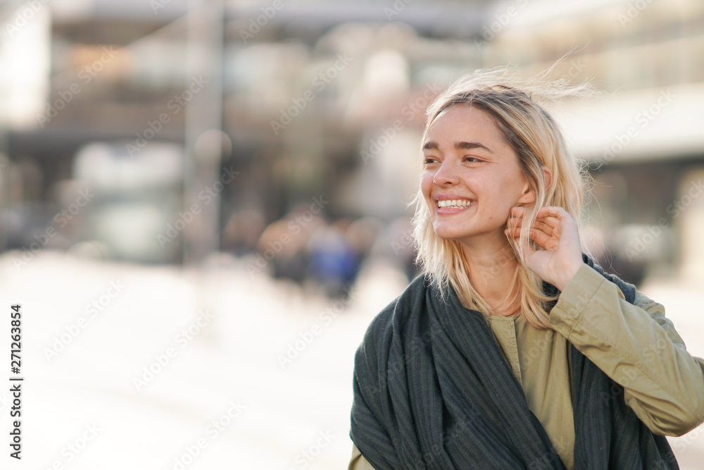 Woman outdoors smiling with copy space Woman outdoors smiling with copy space