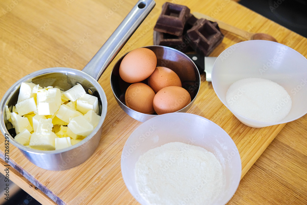 Ingredients for making dessert. Chocolate, eggs, butter, flour Ingredients for making dessert. Chocolate, eggs, butter, flour