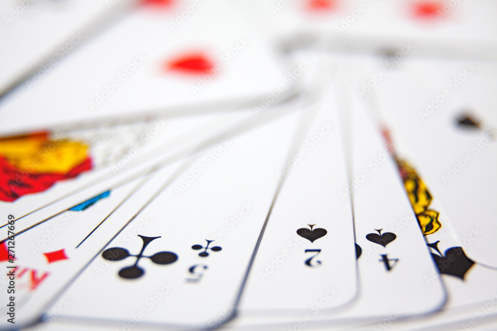 mixed playing cards in a pile