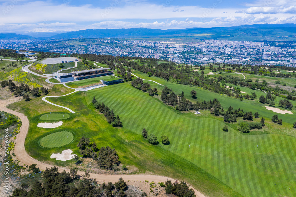 Aerial view of the green golf course in Tbilisi. Georgia. Bird's-eye.