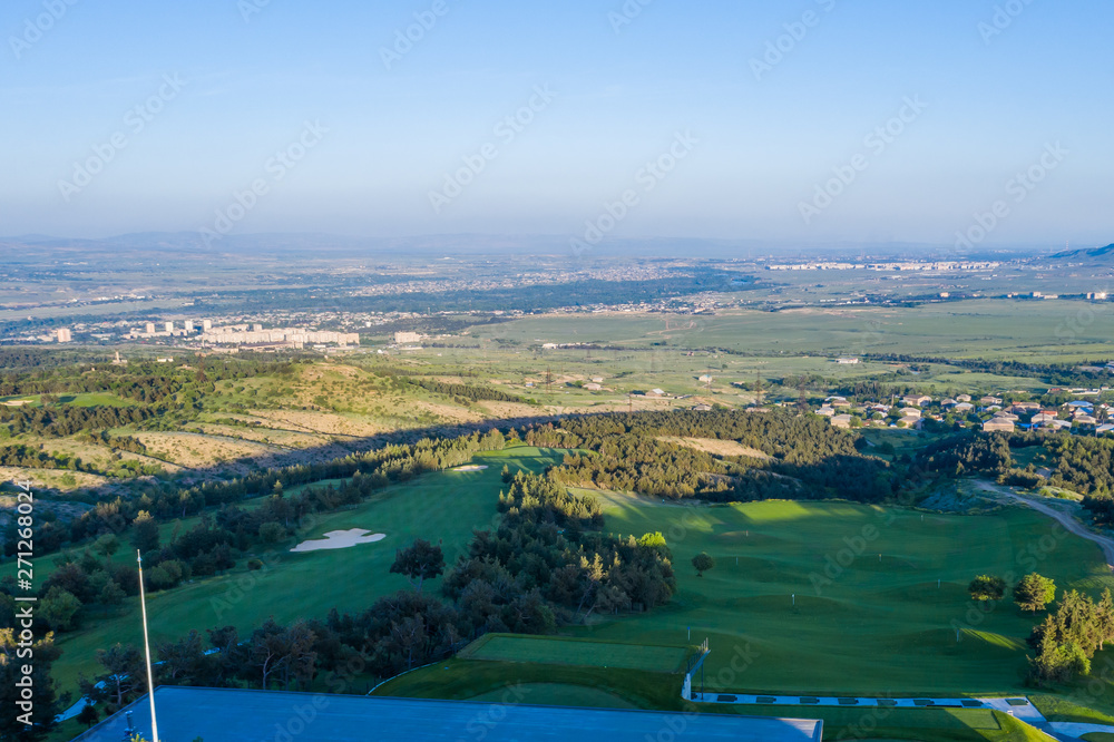 Aerial view of the green golf course in Tbilisi. Georgia. Bird's-eye.