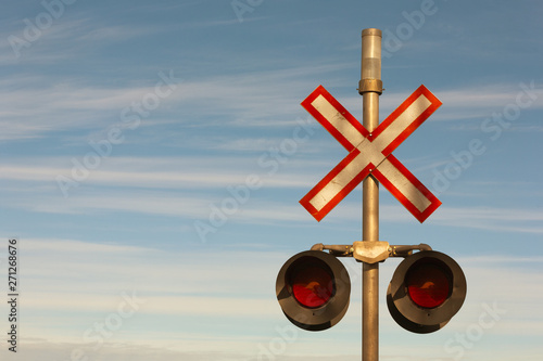 Railroad crossing signal lights and sign. photo