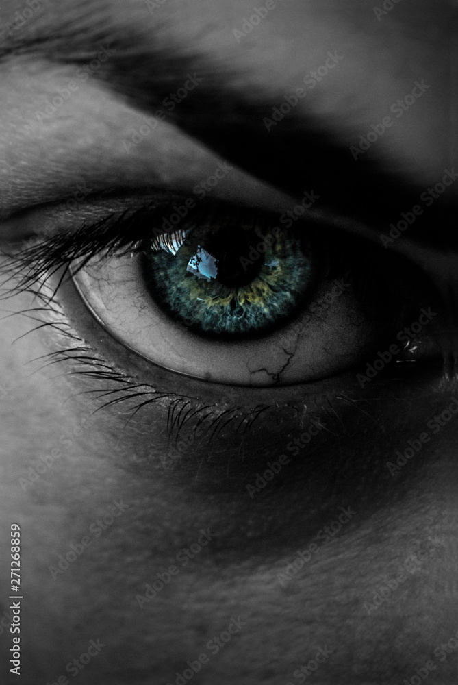 Obraz premium Girl with green eye close up and black and white