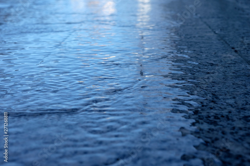 Wet road after rain in blue