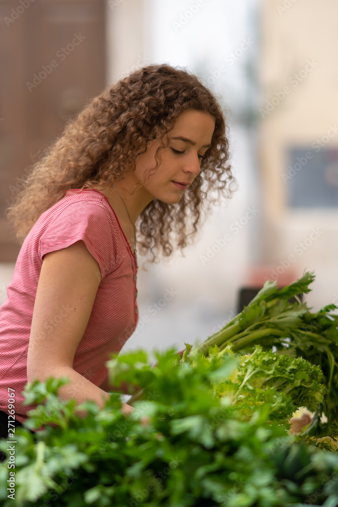 Young woman at the vegetable food market Young woman at the vegetable food market
