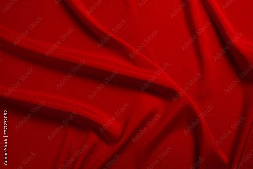 Red silk or satin luxury fabric texture can use as abstract background. Top view. Red silk or satin luxury fabric texture can use as abstract background. Top view.