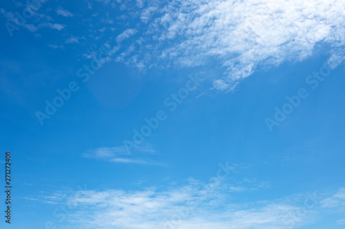 Beautiful white clouds with blue sky.Color shade gradient from white to blue for background wallpaper. © Dilok