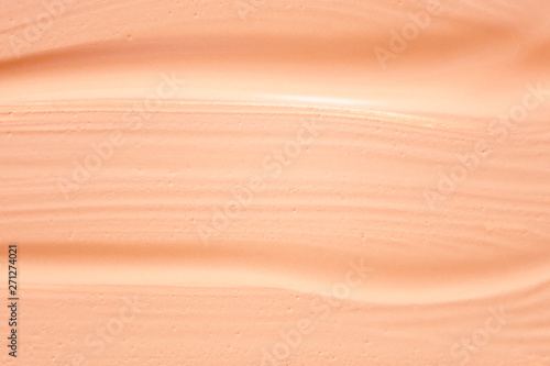 Texture of liquid foundation.Makeup foundation smudges on background.