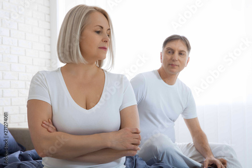 Unhappy couple has problems in relationships. Conflict in family concept. Tired from long relationship. Difficulties in sex.