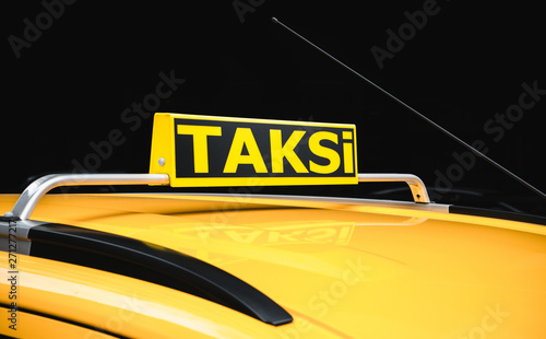 Turkey taxi called Taksi. Yellow taxi car roof sign in turkey waiting for customers or Taksi the sinature of in Istanbul. photo