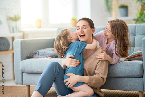 Mom and her daughters are playing