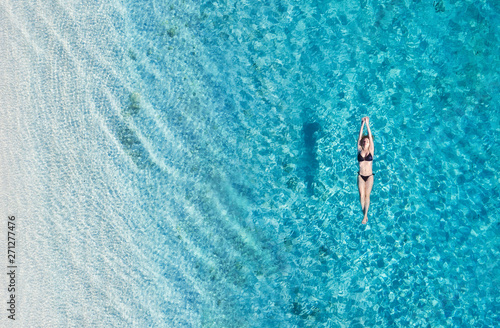 Photography Aerial view of a girl on ocean on Bali, Indonesia