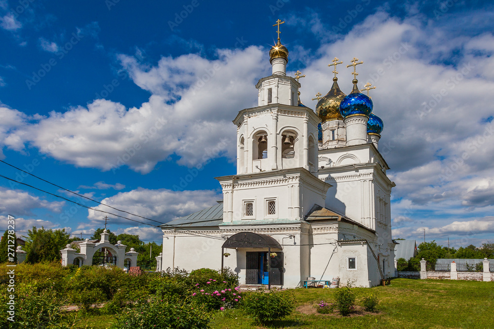 Restored ancient Orthodox church with glittering colored domes