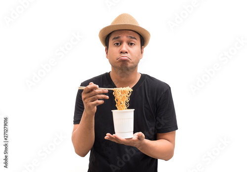 Young man eating noodles