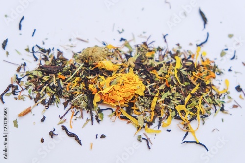 Dry tea from useful herbs and flowers on a light background