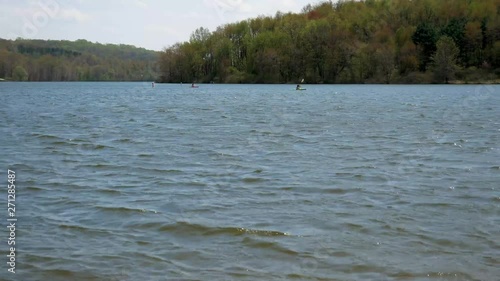 Kayakers padding on a lake