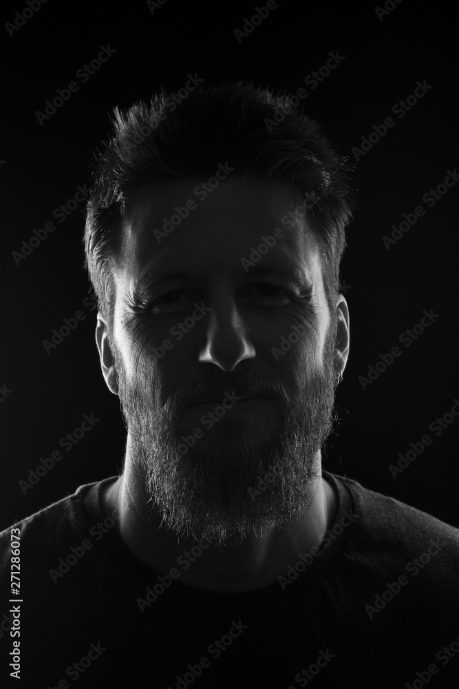 portrait of a man on black background,black and white portrait of a man on black background,black and white