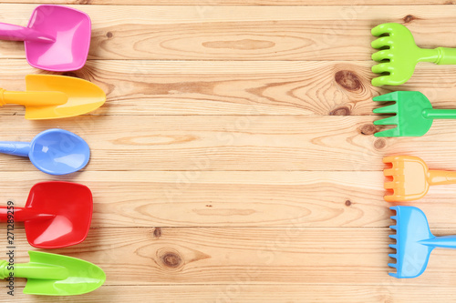 Beach toys on brown wooden table