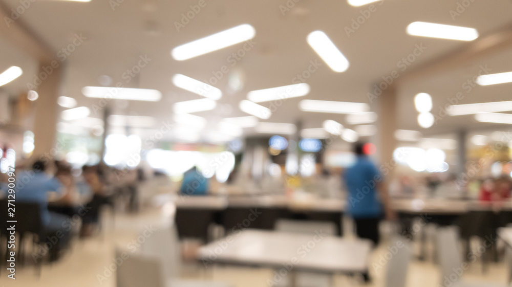 Blur of crowd sitting Eat food in the food court center at the shopping mall abstract background