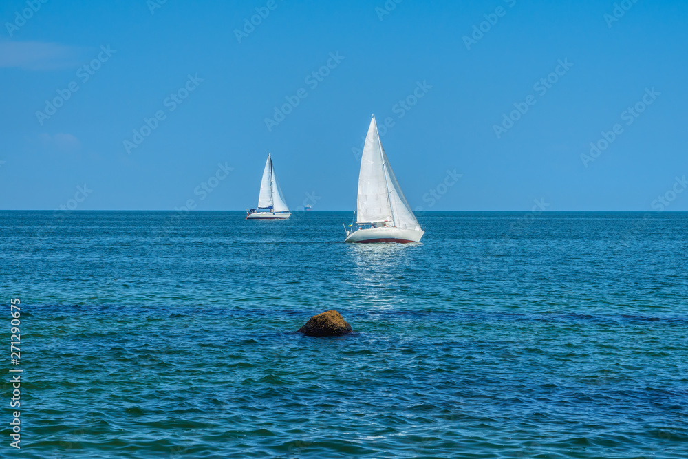 Two white sailboats in Black sea, Odessa, Ukraine