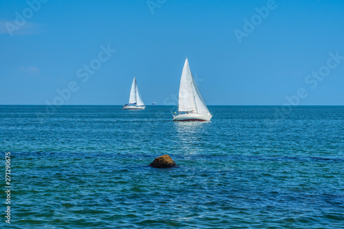 Obraz na płótnie Two white sailboats in Black sea, Odessa, Ukraine w salonie
