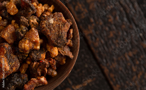 Fotografie Sweet Myrrh Opoponax on a Distressed Wood table