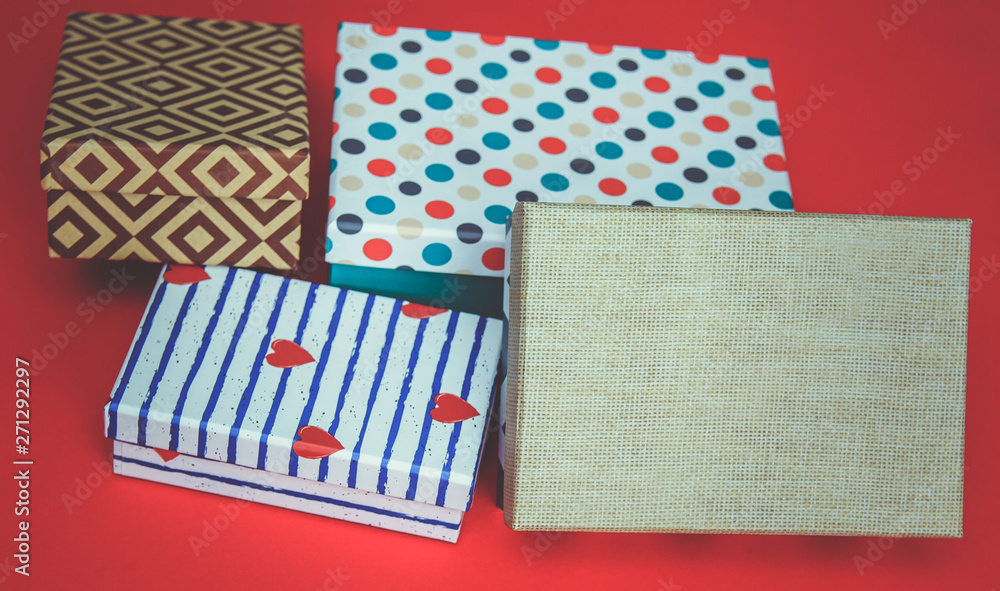 Holiday gift boxes, presents isolated on red background. Holiday gift boxes, presents isolated on red background.