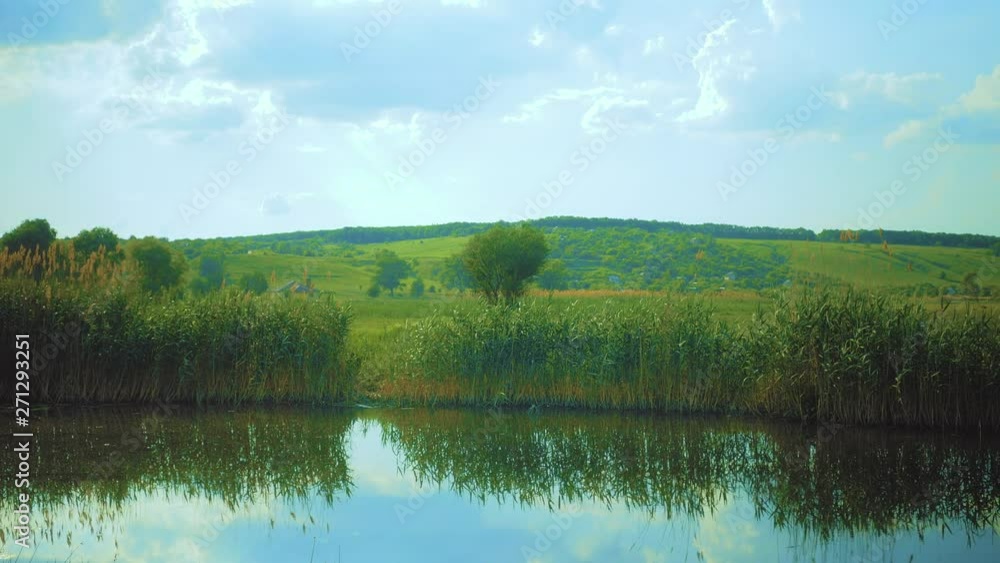 Green valley beyond a river Green valley beyond a river