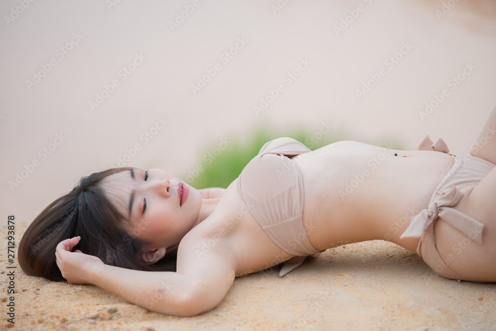 Portrait of young asian beautiful woman wear bikini side river on the daylight,Thailand people,Summer fashion concept,Relax time Portrait of young asian beautiful woman wear bikini side river on the daylight,Thailand people,Summer fashion concept,Relax time